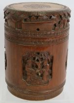 A Chinese carved bamboo caddy jar and cover. Height 16cm. Diameter 12cm. Condition report: No