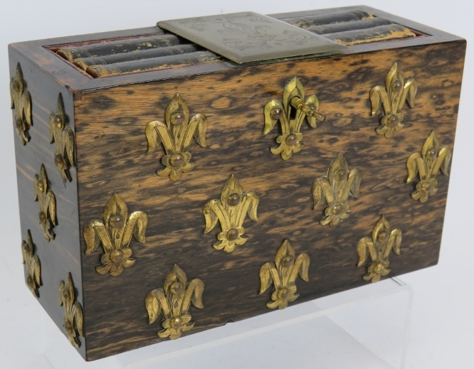 A Victorian coromandel desk top book safe decorated with gilt brass fleur-de-lys and with engraved