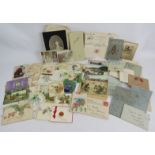 A collection of early 20th century Christmas, greetings and memorial cards along with some local