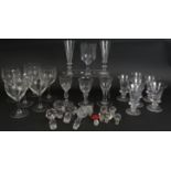 A collection of mainly 19th century drinking glass including two sets of six, two flutes, four odd