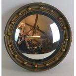 An early 20th Century Atsonea convex mirror in gilt plaster frame. Overall diameter 41cm.