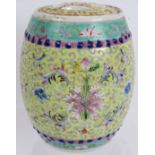 A Chinese porcelain covered jar, decorated in the Famille Jaune palette, signed to lid and rim.