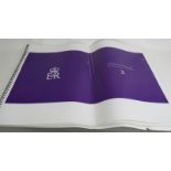 A mock up proof copy of Opus's official Queen Elizabeth II Diamond Jubilee book, spiral bound.