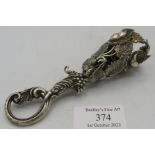 A white metal posy holder, decorated with roses. Condition report: Good condition.