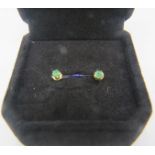 A pair of yellow emerald stud earrings. Approx: 3mm x 3mm. Boxed. Condition report: Good condition.