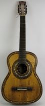 A late 19th century inlaid Spanish guitar bearing a label for Alejandro Roca Y Hermanos, Valencia.
