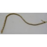 An 18ct yellow gold tennis bracelet set with 60 diamonds, approx 2cts, approx weight 8.4 grams,