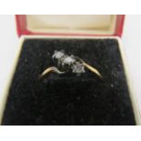An 18ct yellow gold 3 diamond cross over ring. Approx: .2cts. Size O. Boxed. Condition report: