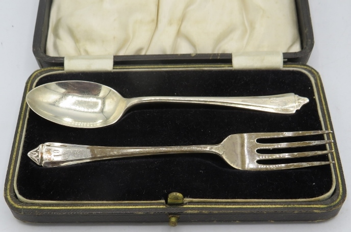 A silver christening spoon and fork. Sheffield 1938. 1.2 troy oz/37 grams. Boxed. Condition
