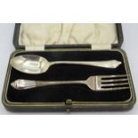 A silver christening spoon and fork. Sheffield 1938. 1.2 troy oz/37 grams. Boxed. Condition