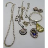 A silver and enamelled locket on a silver link chain, a silver rope type necklace, a silver bangle