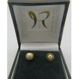 A pair of 14ct yellow gold and diamond stud earrings, marked Hel diamond. Approx: .05 each. Boxed. 2