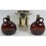 An antique silver plated bottle coaster marked M&Co and two 19th century brown glass flasks with