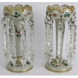 A pair of antique Bohemian milk glass table lustre's hand gilded and decorated with flowers, each