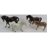 Two Royal Doulton horse figures, a Beswick donkey figure and an unmarked horse figure. Tallest: 17cm