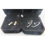 A pair of yellow metal crystal quartz earrings, comprising of 3 graduated stones. one back 9ct the