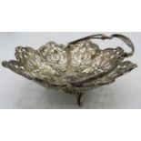 A silver basket shaped bon bon dish with sewing handle and pierced work decoration. Birmingham 1907,