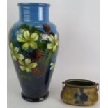 A large Burmantofts Faience pottery vase with floral decoration, stamped 1049, and a squat gilt