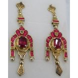 Faceted ruby gemstone earrings with decorative enamelling. Post back. 45mm drop approx. 14k gold/