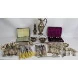 A large quantity of silver plated cutlery, serving ware, decanter labels, cigarette case etc. (Qty).