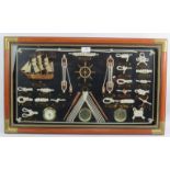 A modern framed nautical montage of objects, including knots, ships parts. Condition report: No