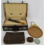 A vintage leather stationery case, an Art Nouveau style leather clutch bag, a razor strop, crocheted