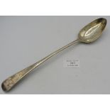 A Georgian silver basting spoon, London 1807, William Eley & William Fearn, monogrammed. Condition