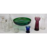 A large iridescent green glass bowl, three liqueur decanters, three bulb vases and two small hand