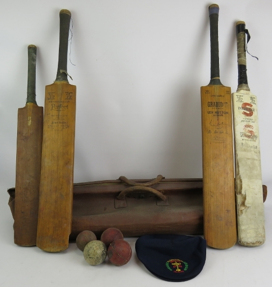 A vintage cricket bag, four vintage cricket bats including a Len Hutton Gradidge bat, four cricket