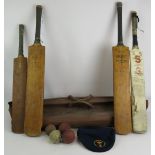 A vintage cricket bag, four vintage cricket bats including a Len Hutton Gradidge bat, four cricket