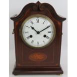 An Edwardian striking mantle clock in an inlaid mahogany case and with enamel dial. Overall height