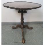 A George III style mahogany tilt-top ‘birdcage’ table with piecrust edge and reeded column, on