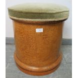 A Victorian walnut inlaid drum commode with green velvet lid and mahogany interior, on a plinth