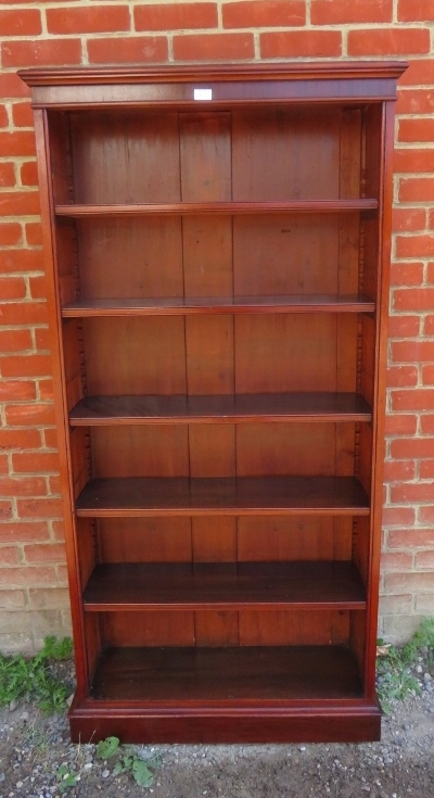 A Victorian mahogany tall open bookcase of five height adjustable shelves, on a plinth base.