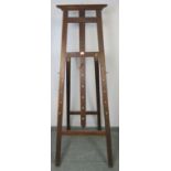 A vintage oak folding artist’s easel with height adjustable pegs. Condition report: Minor marks