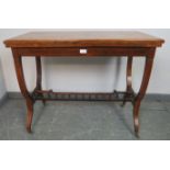 An Edwardian rosewood turnover card table, strung with satinwood and featuring marquetry inlay,