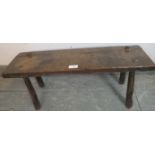An 18th century oak country made pig bench, on canted tapering supports. Condition report: Overall