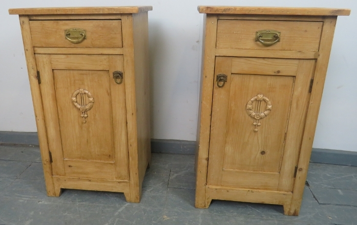 A pair of antique stripped pine bedside cabinets, each with single drawer and cupboard under with