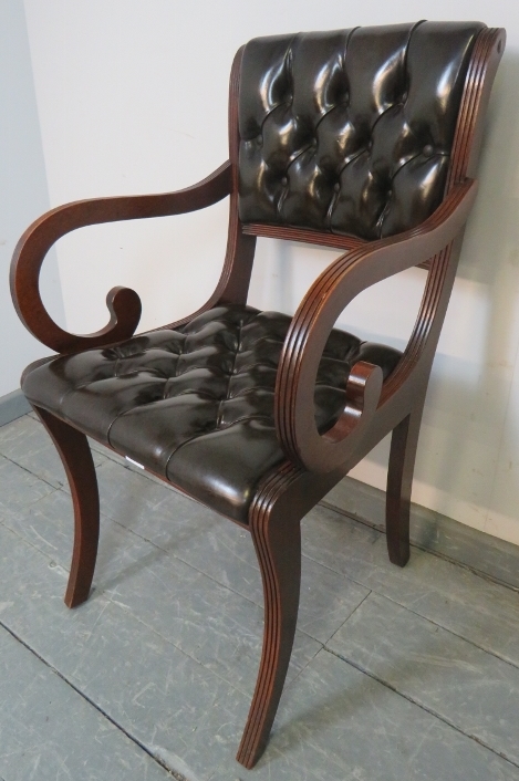 A reproduction mahogany desk chair in the Regency taste, upholstered in chocolate brown buttoned - Bild 2 aus 3