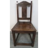 A vintage oak hall chair in a 17th century taste, with relief carved backrest depicting heart