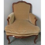 A vintage French oak show-wood armchair, with acanthus carved frame, upholstered in beige draylon,