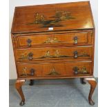 A vintage walnut chinoiserie bureau, hand-painted and relief carved with oriental scenes, the fall-