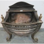 An Edwardian cast iron freestanding fire basket featuring brass finials, with multi-fuel grate, on