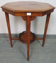 An Edwardian walnut octagonal occasional table, inlaid and strung with satinwood, on tapering square