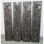 Four Art Nouveau cast iron fireplace slips featuring depictions of songbirds and foliage in a