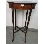 An Edwardian mahogany oval side table, with single drawer, on outswept supports inlaid with