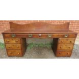 A large 19th century mahogany pedestal sideboard/desk, the top with two long drawers fitted with