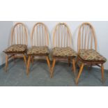 A set of four mid-century elm and beech Windsor Quaker dining chairs by Ercol, on canted supports