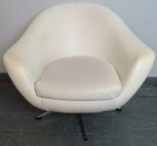 A mid-century ‘Pod’ swivel chair in the manner of Overman, upholstered in white vinyl, on a chrome