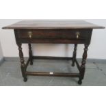 A late 17th century oak side table in unrestored condition, with single drawer featuring original